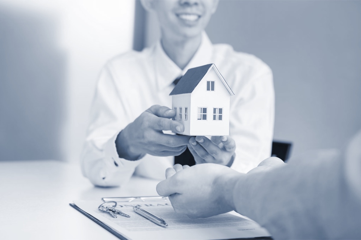 A Derby Services adviser meeting a client about home finance
